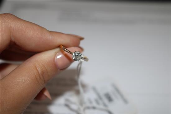 An 18ct gold and platinum solitaire diamond ring,